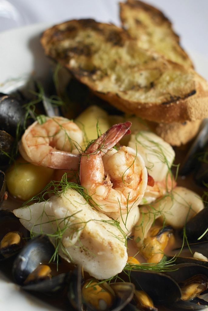 A seafood dish plated and ready to serve
