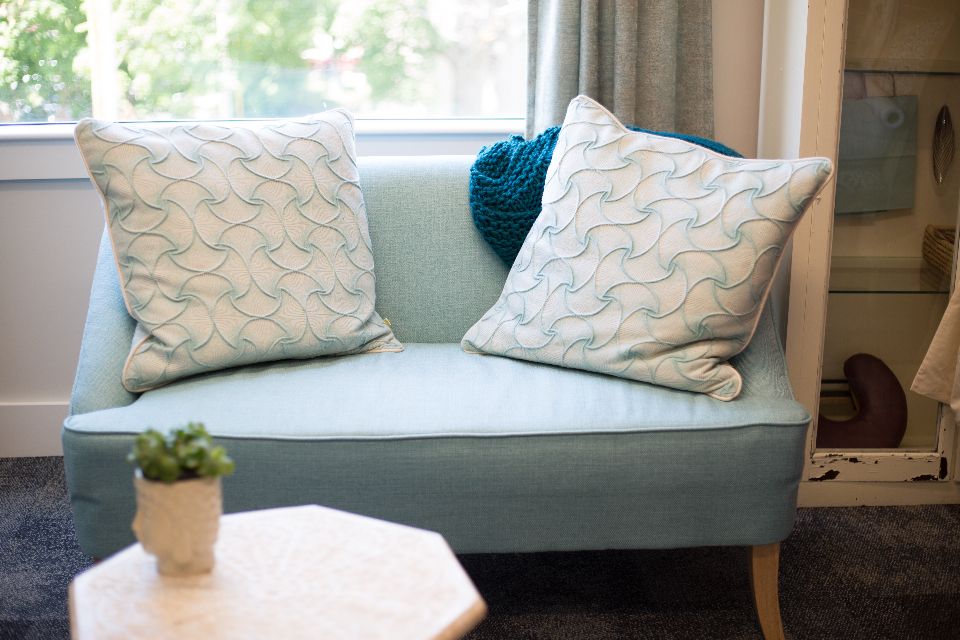 A suite sitting room with a sofa and armchairs
